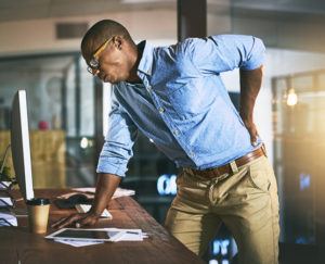 man with back pain on the job