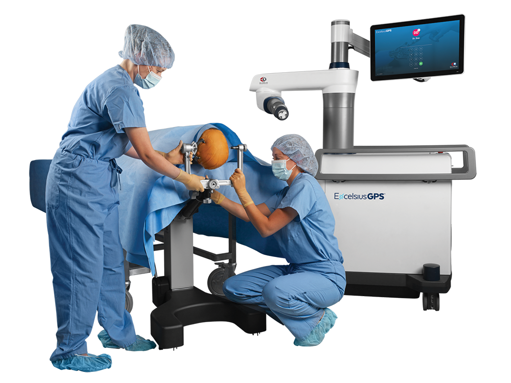 Surgeons attaching fixation frame to stand