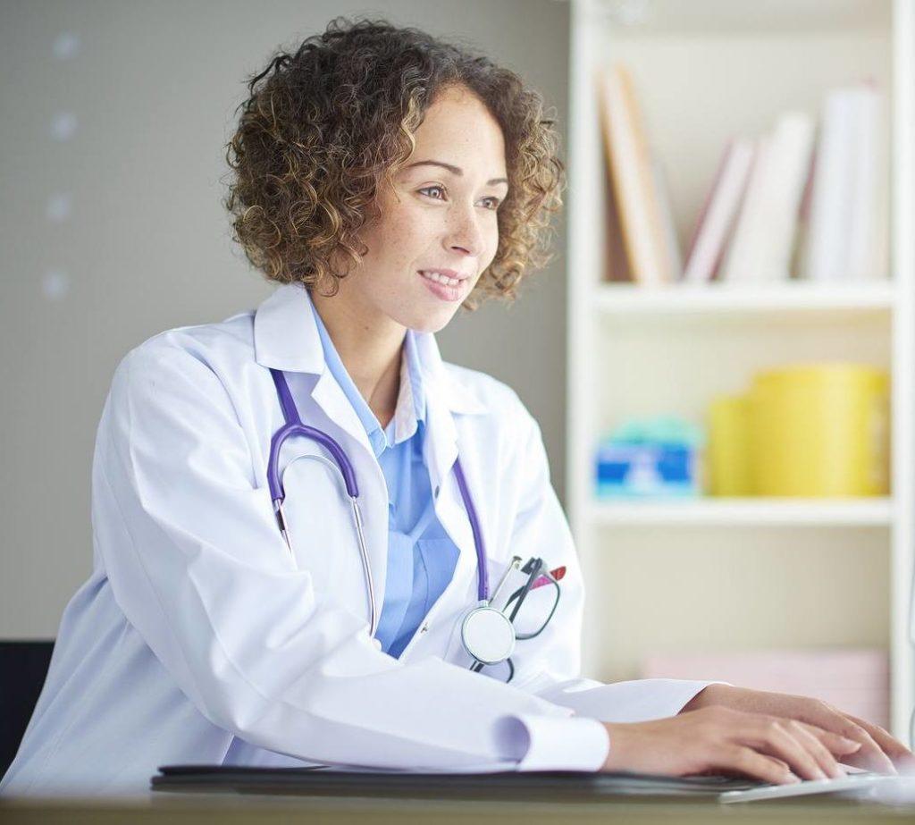 female doctor sitting at her desk