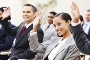 Business People Raising Their Hands