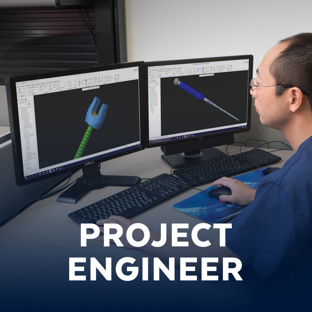 Project engineer looking at computer monitors
