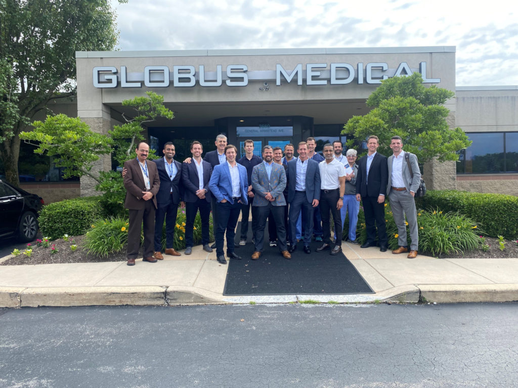 MERC course members posing in front of Globus Medical building