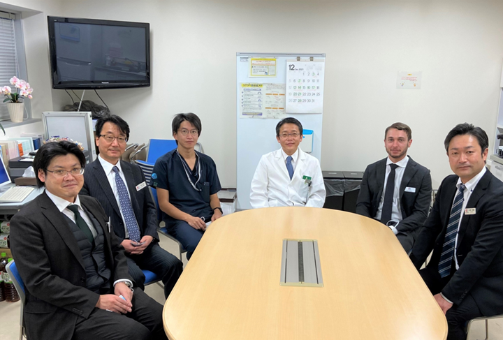 Japanese surgeons sitting around table