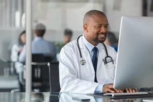 Doctor looking at computer