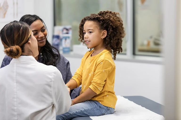 Pediatrician with child