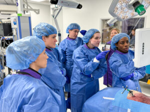 Group of surgeons looking at a screen in OR
